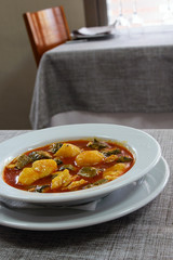 National Spanish cuisine of Valencia. Unique delicious Allipebre dish. Freshwater eel from Lake Albufera stewed with potatoes. Travel to Valencia.