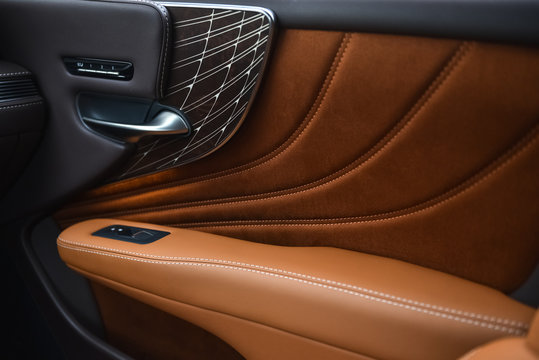 interior of a car. door handle and luxury trims.