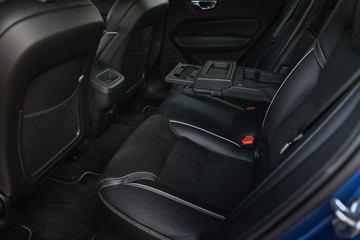 interior of a car. rear seats and arm rest.