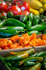 A display of vibrant chillies for sale on a market stall