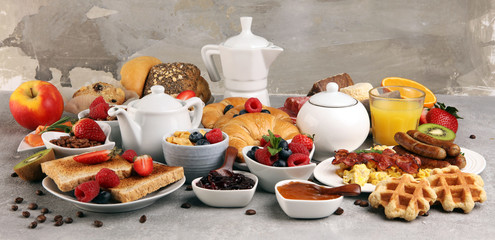 Breakfast served with coffee, orange juice, croissants, cereals and fruits. Balanced diet. 