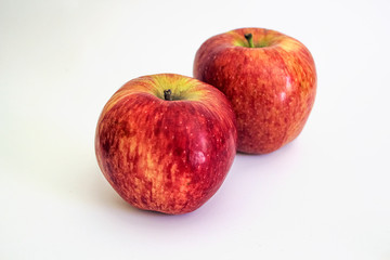 Fototapeta na wymiar Two ripe red apple. Isolated on a white background.