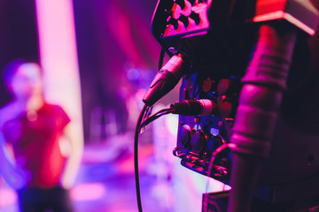 Professional equipment in a blue television news studio. Lighting devices and video cameras on a...
