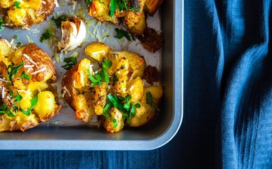 Close up shoot of a baked, roasted potatoes in a oven tray