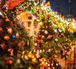 Fototapeta na wymiar Festive street decoration in Moscow. Christmas fir tree garland illumination lights with christmas tree decoration. Bright Christmas and New Year background
