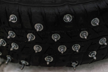 car wheels and tires in the snow in winter in the cold