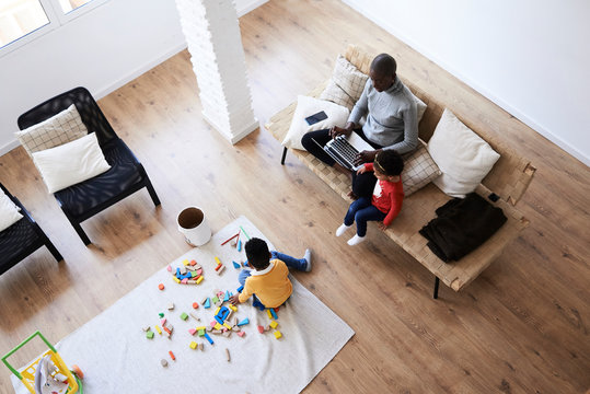 Black Afro Mother Working From Home With Kids.