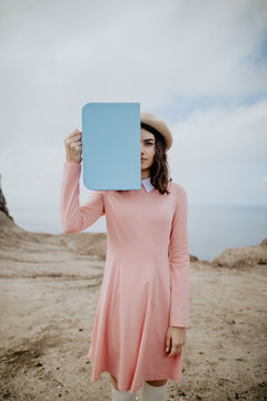 Girl covering half of her face