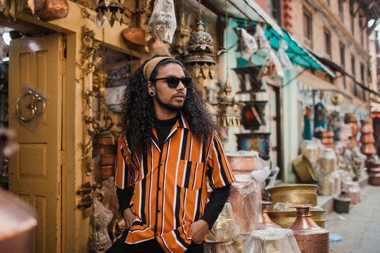 Portrait of a young South Asian man on the street of Kathmandu.