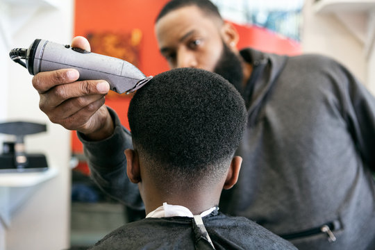 Barber: Focus On Boy's Hair In Rear View
