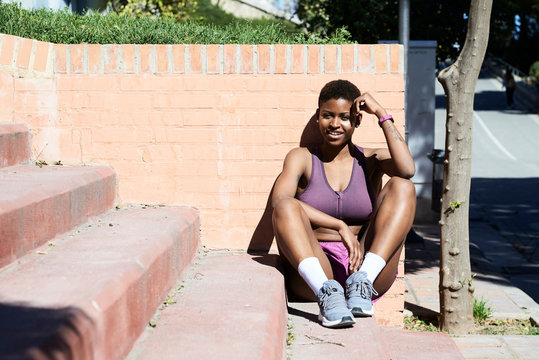 Black afro athlete resting.