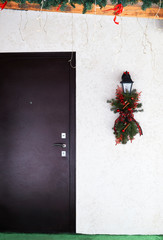 Christmas decoration of a street lamp on the porch of the cottage