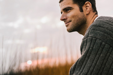 Portrait of Happy Handsome man Outdoors in Fall at Beach