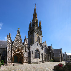 Fototapeta na wymiar Gothic city church of Pont-Croix with its high pointed steeple, Bretagne in France