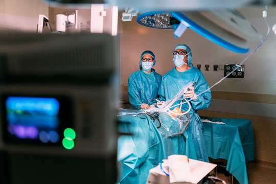 Professional medical team performing surgery in hospital