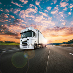 Truck with container on highway, cargo transportation concept. Shaving effect.