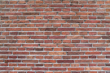 Weathered stained red brown old brick wall background