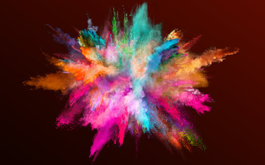 Colored powder explosion on gradient dark background. Freeze motion.