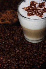 Christmas cappuccino with cinnamon and coffee beans