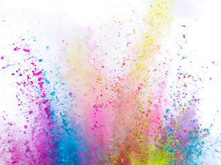 Obraz premium Colored powder explosion on white background. Freeze motion.