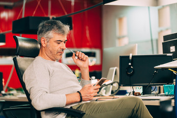 Businessman looking at his mobile phone