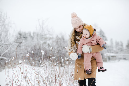 Mom and baby together in the snow