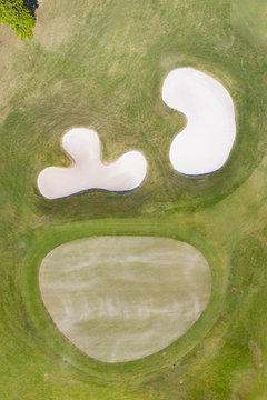 Sand bunker on the beautiful golf course, aerial view.