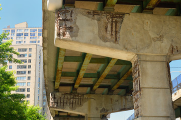 Crumbling concrete and rust under the Gardiner Expressway Toronto