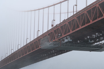 Painting Scaffolding under Golden Gate Bridge on Foggy Day