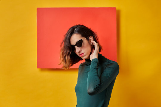 Portrait of a young woman in front of a colorful background