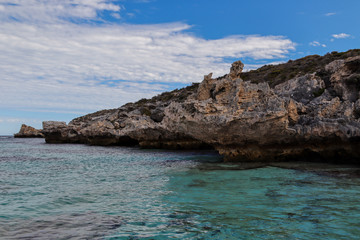 Rocky coastline with clear water on a summer day
