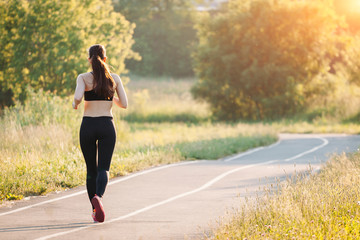 young woman running in park