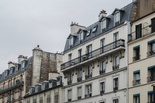 Residential building against gray sky