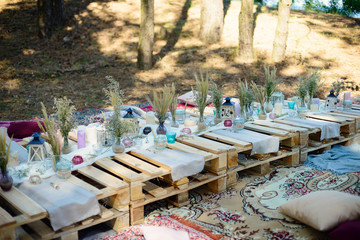 Boho style party decor in the forest. Party decoration for a bachelorette party.