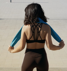  Young athlete woman uses a towel after a fitness session