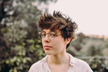 Portrait of young woman with short cute hair
