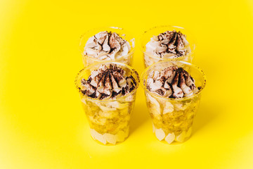 Cakes with white cream on a yellow background. Baking and sweets.