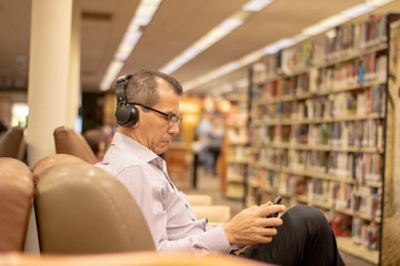 man reading in library
