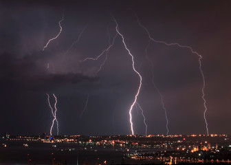 Dangerous storm of lightning and lightning in the clouds that touch the ground