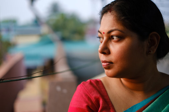 Portrait of beautiful young woman wearing saree in sunset light