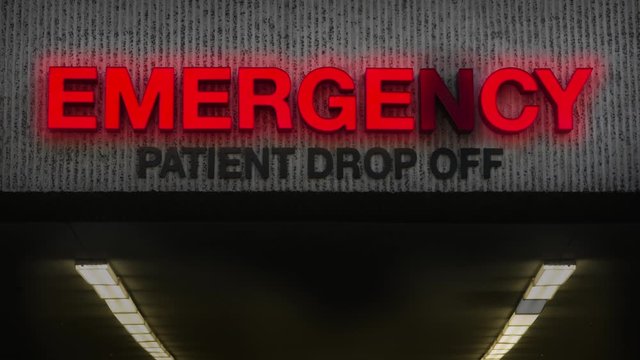Healthcare Video Of A Rundown Emergency Room Sign At A Hospital With Broken Light