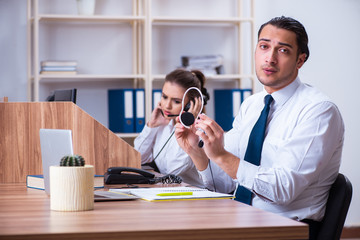 Call center operators working in the office