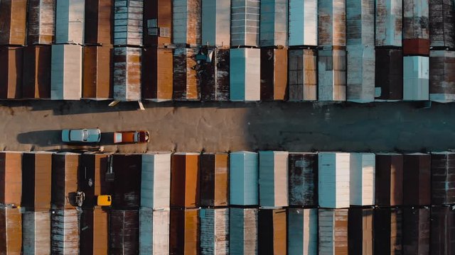 Top view on the roofs of old rusty garages. Garages have a different color.