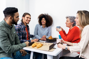 Portrait of successful team having fun at work