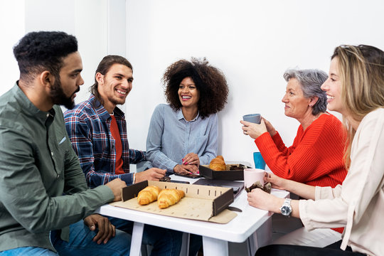 Portrait of successful team having fun at work