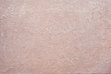 It is a horizontal abstract solid pink-beige with silvering light background with rough texture. Texture in the form of brush strokes. Suitable for any design