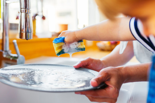 Pregnant mom and son in the kitchen.