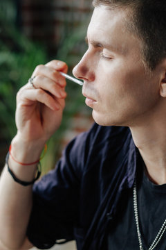 Professional man preparing perfume