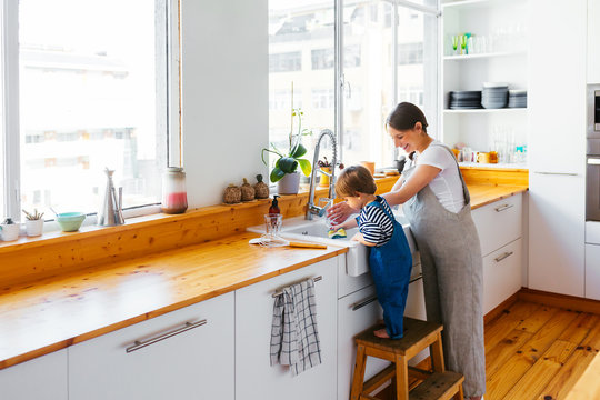 Pregnant mom and son in the kitchen.