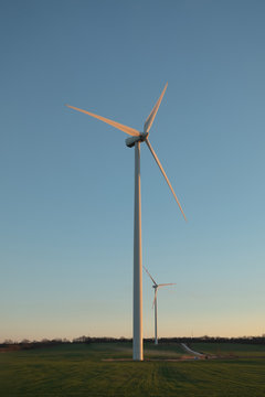 Windmill on the green field